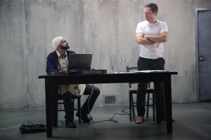 Usman Ally and Justin Kirk in The Invisble HandPhoto by Joan Marcus